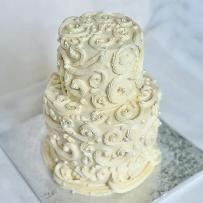 Tiered ivory buttercream wedding cake